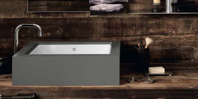 The Corian&reg; Refresh washbasin smoothly set into Corian&reg; in the industrial grey Deep Cloud shade